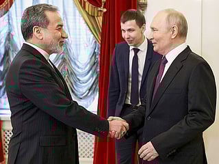 Russian President Vladimir Putin, right, shakes hands with Iranian Foreign Minister Abbas Araghchi during their meeting at the Boris Yeltsin Presidential Library, in St. Petersburg, Russia, on Monday, April 27, 2026. 