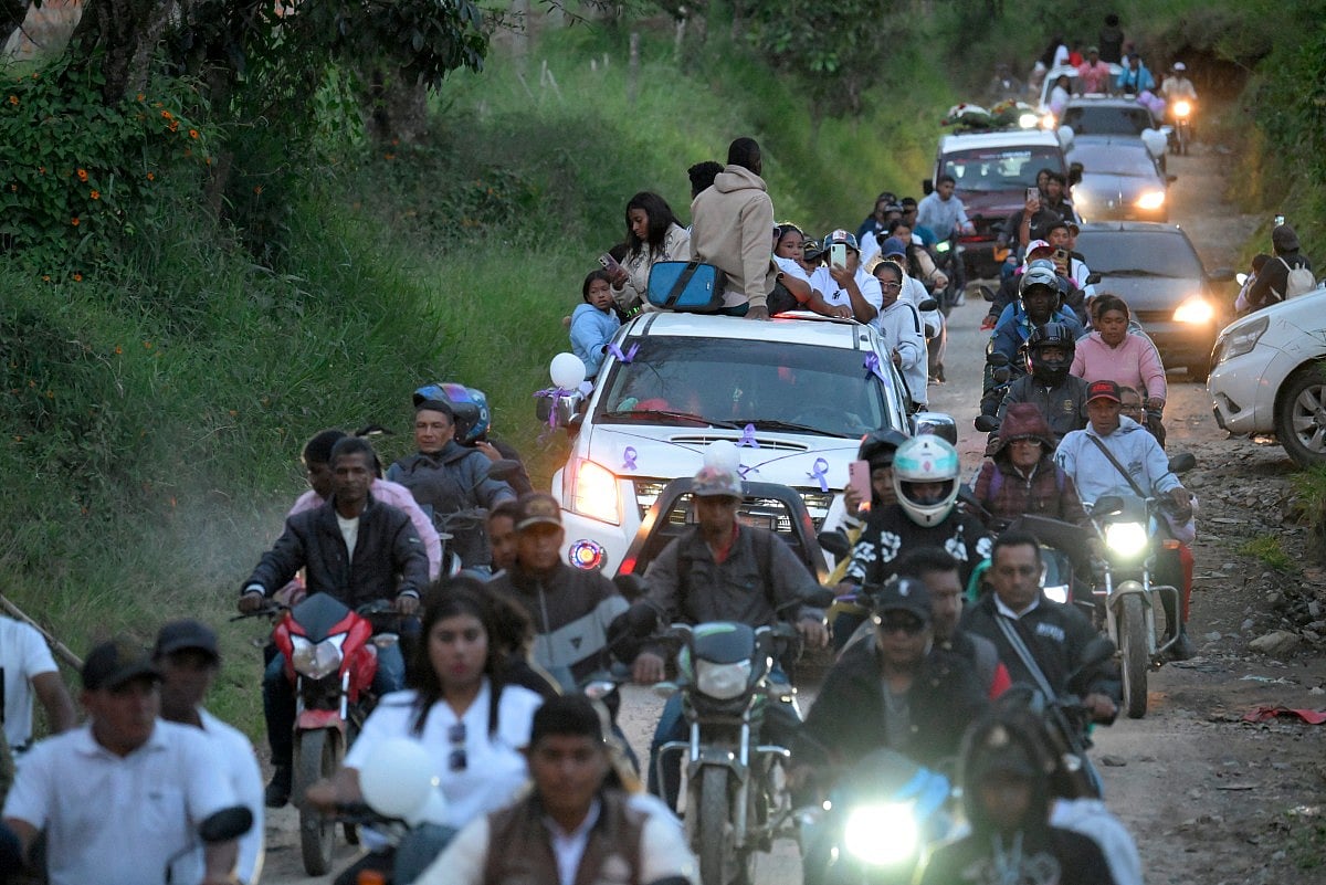 Vehicles drive during a funeral procession following a bomb attack in Cajibio, Cauca department, Colombia, on April 27, 2026.