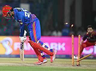 Delhi Capitals Indian cricket player Sahil Parakh is bowled out by Royal Challengers Bengaluru's Indian cricket player Bhuvneshwar Kumar during the 2026 Indian Premier League 