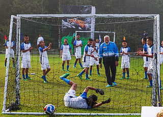 Prime Minister Narendra Modi plays football with youngsters, in Gangtok on Tuesday. 