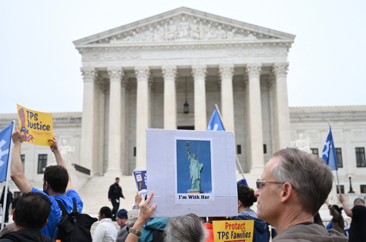 Members of the National TPS Alliance rally at the US Supreme Court in Washington, DC, on April 29, 2026.