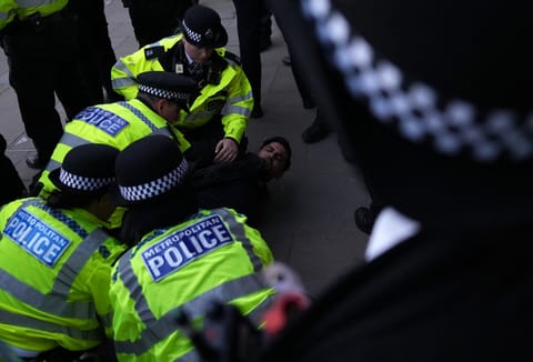 Police arrest a demonstrator during a rally organised by the Campaign Against Antisemitism, opposite Downing Street in central London on April 30, 2026, following the stabbing of two Jewish men the day before in the Golders Green neighbourhood of north London.