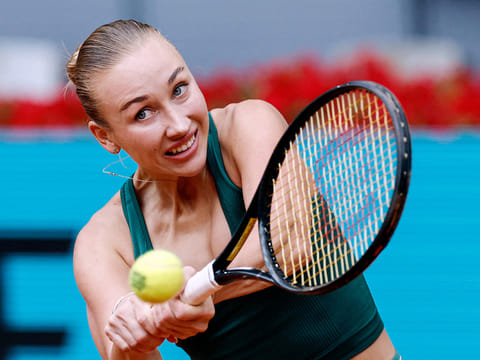 Austria's Anastasia Potapova returns the ball to Czech Republic's Karolina Pliskova during her 2026 WTA Tour Madrid Open tennis tournament singles match at the Caja Magica in Madrid, on April 29, 2026.