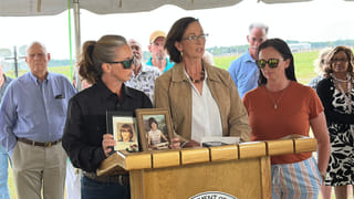 Lynn Cobb, center, speaks about her younger sister Cynthia Driggers while Driggers' niece Tanya Clement holds up photos of Cynthia Driggers after her killer, James Ernest Hitchcock, was executed on Thursday, April 30, 2026, in Starke, Fla. (AP Photo/Jeffrey Collins)