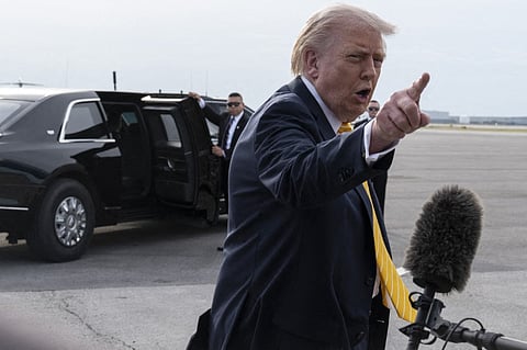 President Donald Trump speaks to journalists before boarding Air Force One at Palm Beach International Airport on May 2, 2026 in Palm Beach, Florida.