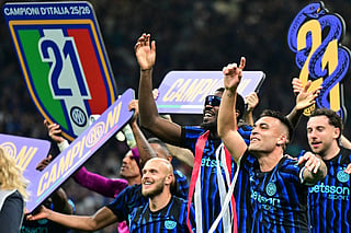 Inter Milan's French forward #9 Marcus Thuram and Inter Milan's Argentinian forward #10 Lautaro Martinez celebrate with teammates after winning their 21st 'scudetto' following the Italian Serie A football match between Inter Milan and Parma at San Siro stadium in Milan, on May 3, 2026.