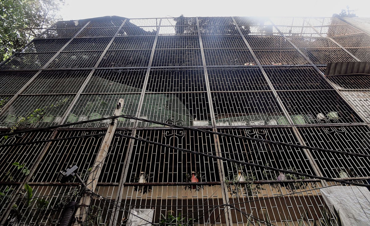 A view of the four-storey residential building in the Vivek Vihar area after a massive fire breaks out resulting in nine deaths and some injuries, in New Delhi on Sunday.