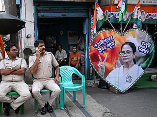 Police personnel guard the road leading towards the residence of West Bengal Chief Minister and All India Trinamool Congress (TMC) party chairperson Mamata Banerjee in Kolkata on May 5, 2026 after her party lost the recently concluded state legislative assembly elections. 