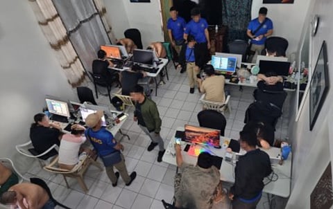 A scene of a Philippine police raid on a text scam hub in Subic, Zambales. File photo taken on September 4, 2024. Philippine police has ramped up its drive against illegal text blasters from shuttered offshore gaming ops, sold guerrilla-style online.
