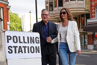 Britain's Prime Minister Keir Starmer and wife Victoria arrive at a polling station in central London, Thursday, May 7, 2026 to cast their votes in the local elections.