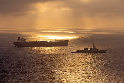 This US Navy handout photo released on May 8, 2026 by US Central Command Public Affairs, shows the Arleigh Burke-class guided-missile destroyer USS Rafael Peralta (DDG 115) implementing a maritime blockade against the Iran-flagged crude oil tanker vessel Herby while the latter was attempting to sail toward an Iranian port, on April 24, 2026.