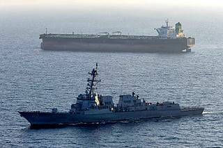 This US Navy handout photo released on May 7, 2026 by US Central Command Public Affairs, shows the Arleigh Burke-class guided-missile destroyer USS Rafael Peralta (DDG 115) implementing a maritime blockade against the Iran-flagged crude oil tanker vessel Stream while the latter was attempting to sail toward an Iranian port, on April 26, 2026.