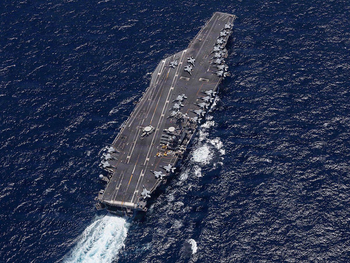 This US Navy handout photo released by US Central Command Public Affairs shows Nimitz-class aircraft carrier USS George H.W. Bush (CVN 77) sailing in the Arabian Sea.