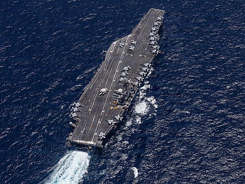 This US Navy handout photo released by US Central Command Public Affairs shows Nimitz-class aircraft carrier USS George H.W. Bush (CVN 77) sailing in the Arabian Sea. 