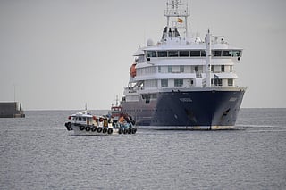 US passengers from the Dutch flagged hantavirus-stricken cruise ship MV Hondius are transferred by boat to the industrial port of Granadilla de Abona on the island of Tenerife in Spain's Canary Islands on May 10, 2026.