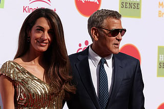 US actor George Clooney and his wife Amal Clooney arrive to attend A King's Trust celebration at the Royal Albert Hall in London on May 11, 2026, to celebrate the 50th anniversary of The King’s Trust.