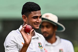 Bangladesh's Nahid Rana acknowledges the crowd after taking a five-wicket haul after his team's win.