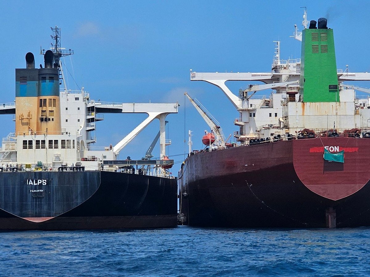 This handout photo from United Against Nuclear Iran shows two oil tankers making a ship-to-ship transfer of Iranian oil in the Eastern Outer Port Limits (EOPL), 70 kilometers off Malaysia.