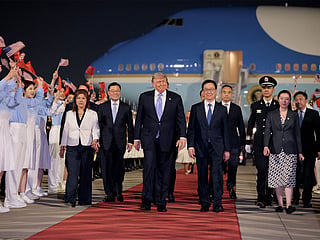 US President Donald Trump arrives aboard Air Force One at Beijing Capital International Airport during his visit to the country, in Beijing, China  