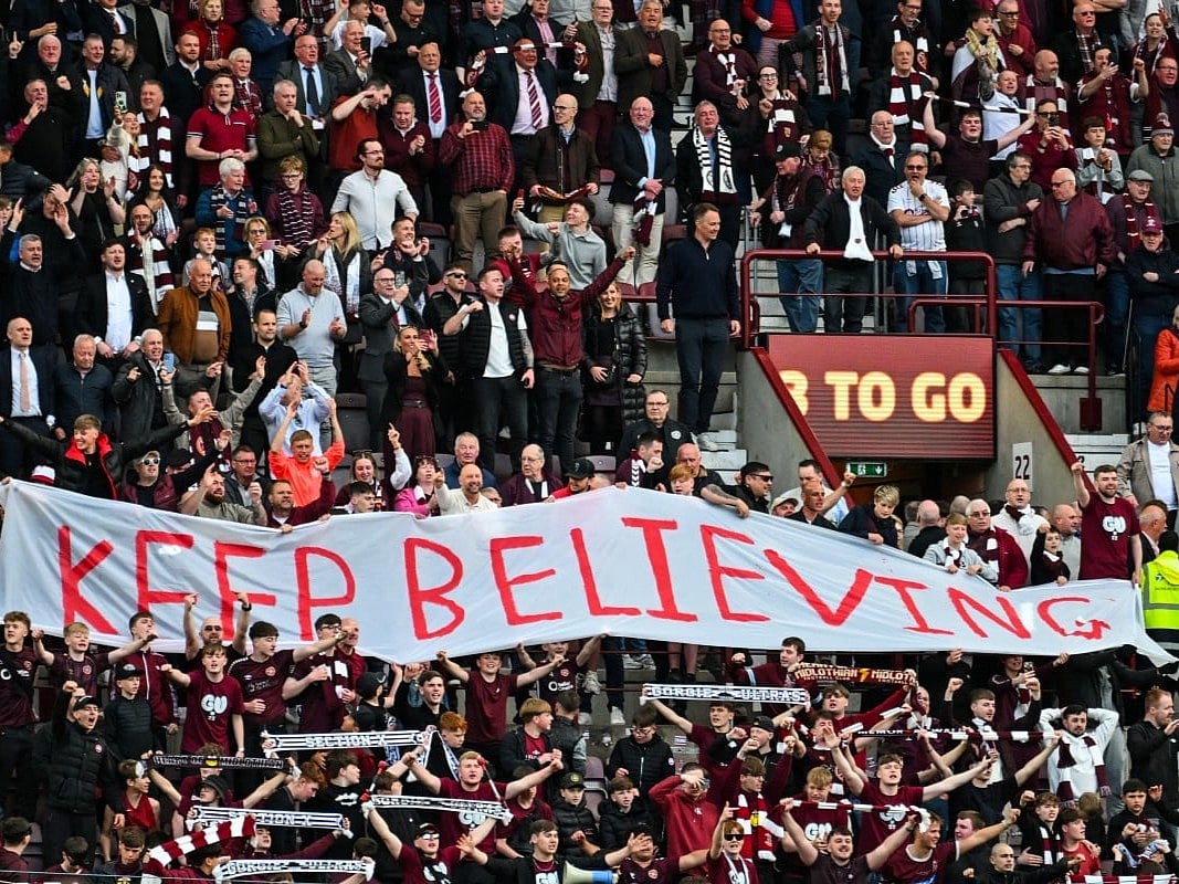Hearts fans react after the final whistle in the Scottish Premiership football match between Hearts and Rangers at Tynecastle Stadium