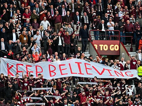 Hearts fans react after the final whistle in the Scottish Premiership football match between Hearts and Rangers at Tynecastle Stadium 