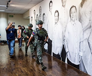 Marines stationed at the Senate are seen after gunshots were heard on Wednesday night (May 13, 2026).

