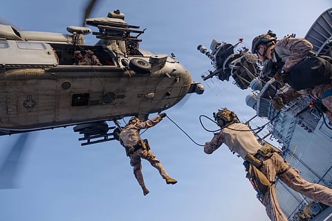 US Marines from the 31st Marine Expeditionary Unit rappel out of an MH-60S Sea Hawk during scheduled training aboard USS Tripoli (LHA 7). Tripoli is one of more than 20 warships supporting the US blockade against Iran. Since the start of the blockade, CENTCOM forces have redirected 111 commercial ships, and disabled 4. as of May 29, 2026.