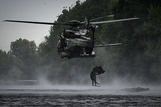 French Foreign Legion combat divers from the 2nd Foreign Parachute Regiment (2e REP) leap from a NH90 Caïman helicopter into the River Vienne during an airborne water insertion exercise in Ingrandes, south-western France, on May 18, 2026.