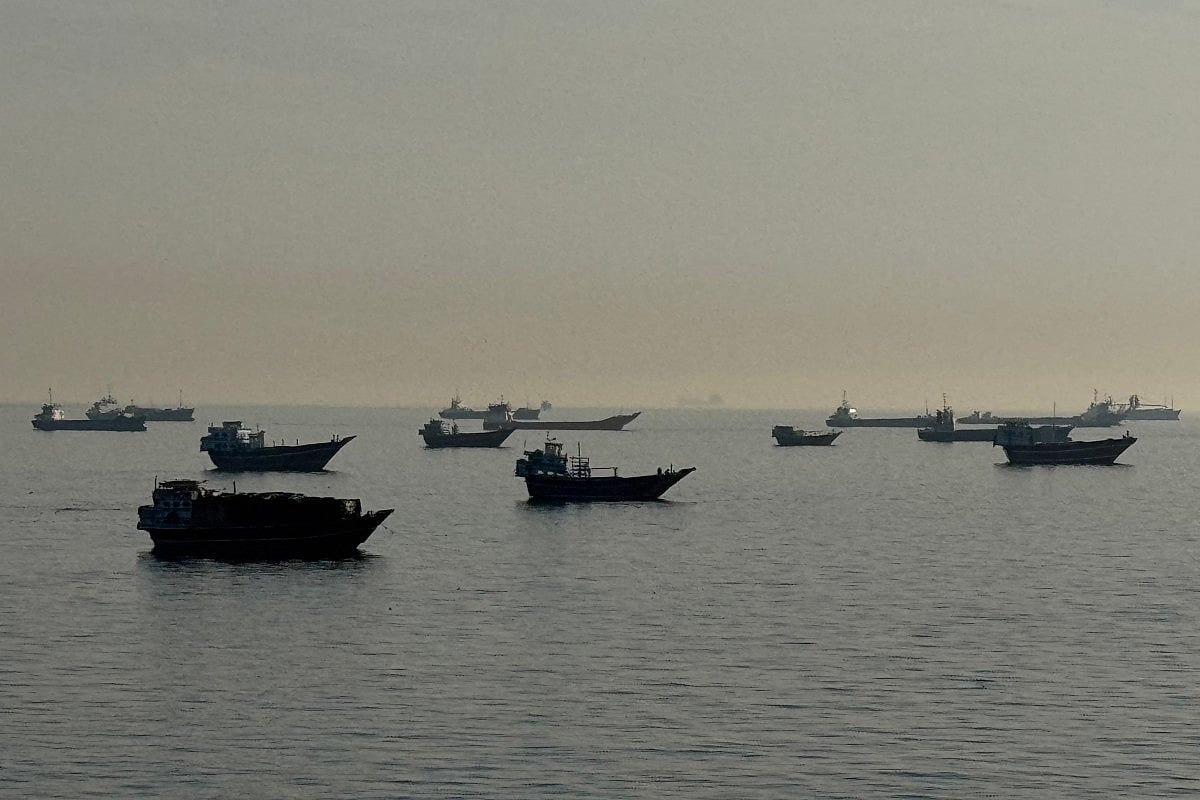 Vessels are seen anchored in the Strait of Hormuz, off the port city of Khasab on Oman’s northern Musandam Peninsula on May 17, 2026.