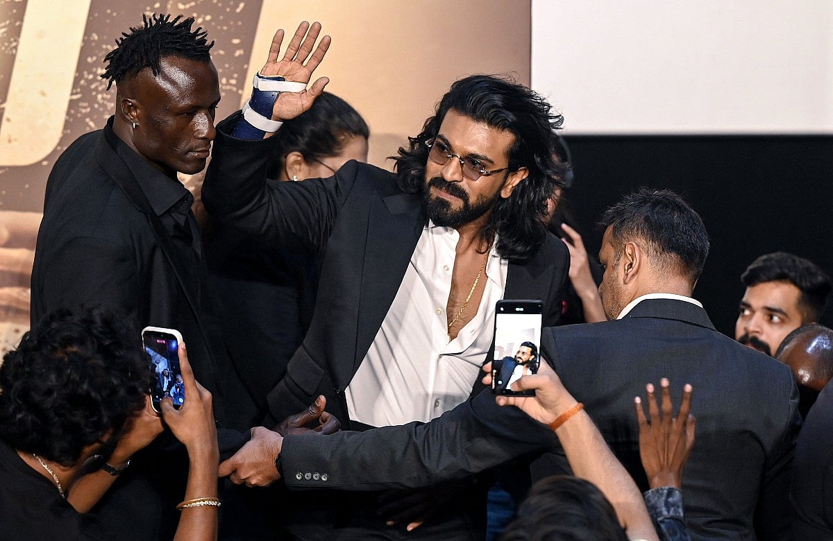 Indian actor Ram Charan (C) attends the trailer launch of his upcoming film 'Peddi' in Mumbai on May 18, 2026.