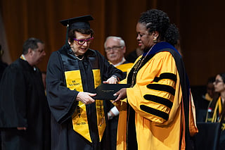 Tennis legend Billie Jean King, left, receives her diploma from California State University, Los Angeles, President Berenecea Johnson Eanes during commencement in Los Angeles, Monday, May 18, 2026. (AP Photo/Jae C. Hong)