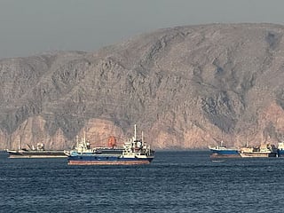 Ships at Anchor in the Strait of Hormuz, off Oman's northern coast.  