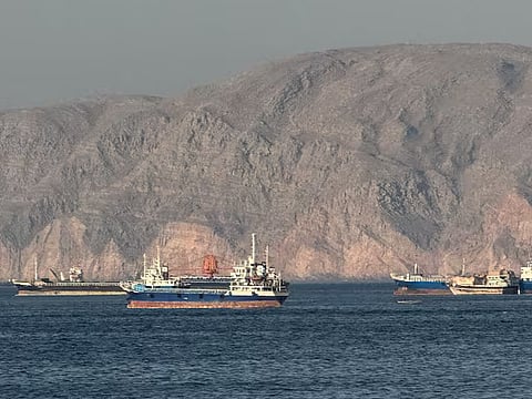 Ships at Anchor in the Strait of Hormuz, off Oman's northern coast.  