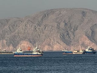Ships at Anchor in the Strait of Hormuz, off Oman's northern coast.  