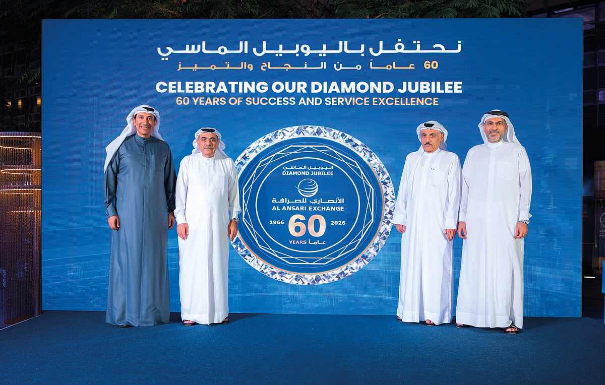 Rashed A. Al Ansari, Group CEO of Al Ansari Financial Services (extreme right); Mohammad A. Al Ansari, Chairman of Al Ansari Financial Services (inside right); Fuad A. Al Ansari, Board Member of Al Ansari Financial Services (inside left); and Eisa A. Al Ansari, Board Member of Al Ansari Financial Services (extreme left)