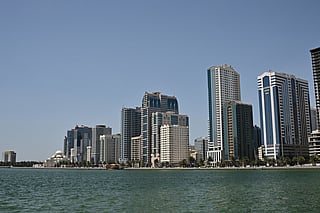A photograph shows the Al-Nooor Mosque (L) and the city skyline in Sharjah in the United Arab Emirates on May 21, 2026.