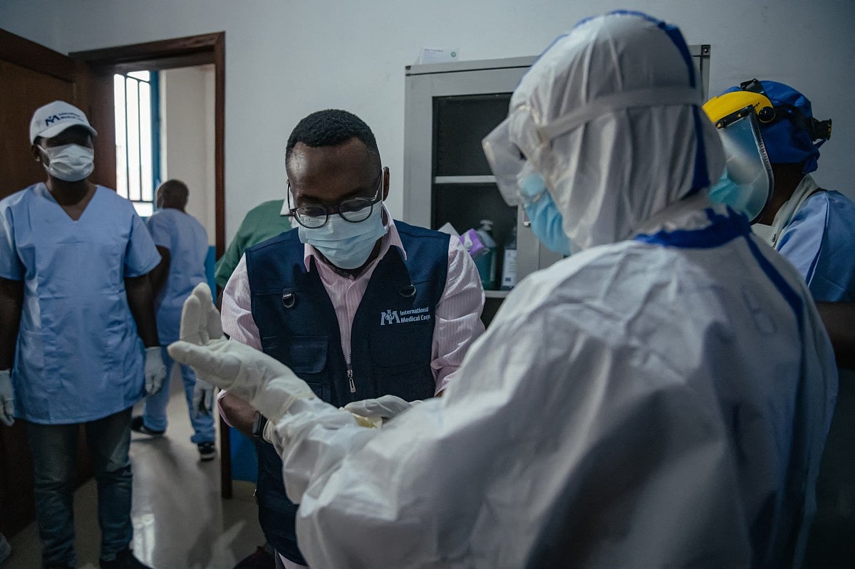 Dr Abdou Sebushishe, Senior Health Advisor at International Medical Corps, guides and shows CBCA Virunga doctors how to properly put on single-use personal protective equipment provided by International Medical Corps, as part of support for Ebola virus disease prevention measures in Goma, on May 21, 2026.