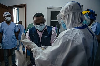 Dr Abdou Sebushishe, Senior Health Advisor at International Medical Corps, guides and shows CBCA Virunga doctors how to properly put on single-use personal protective equipment provided by International Medical Corps, as part of support for Ebola virus disease prevention measures in Goma, on May 21, 2026.