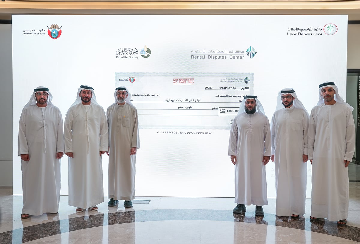 Officials from Rental Disputes Center and Dar Al Ber Society during the donation ceremony in Dubai