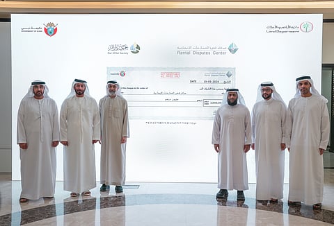 Officials from Rental Disputes Center and Dar Al Ber Society during the donation ceremony in Dubai