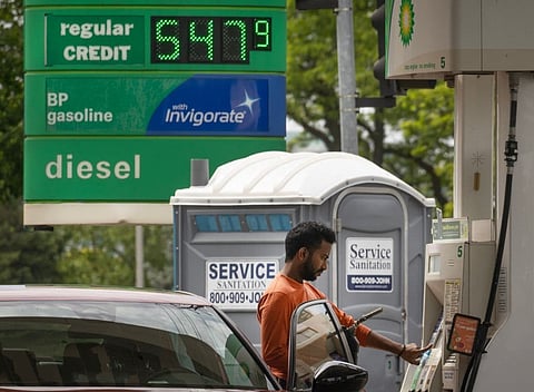 A customer fills up his car at a BP fuel station. File photo taken on May 21, 2026 in Skokie, Illinois.  