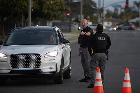 Garden Grove police direct evacuees towards a shelter after a chemical leak from a large storage tank threatened residents in Garden Grove, California on May 22, 2026.
