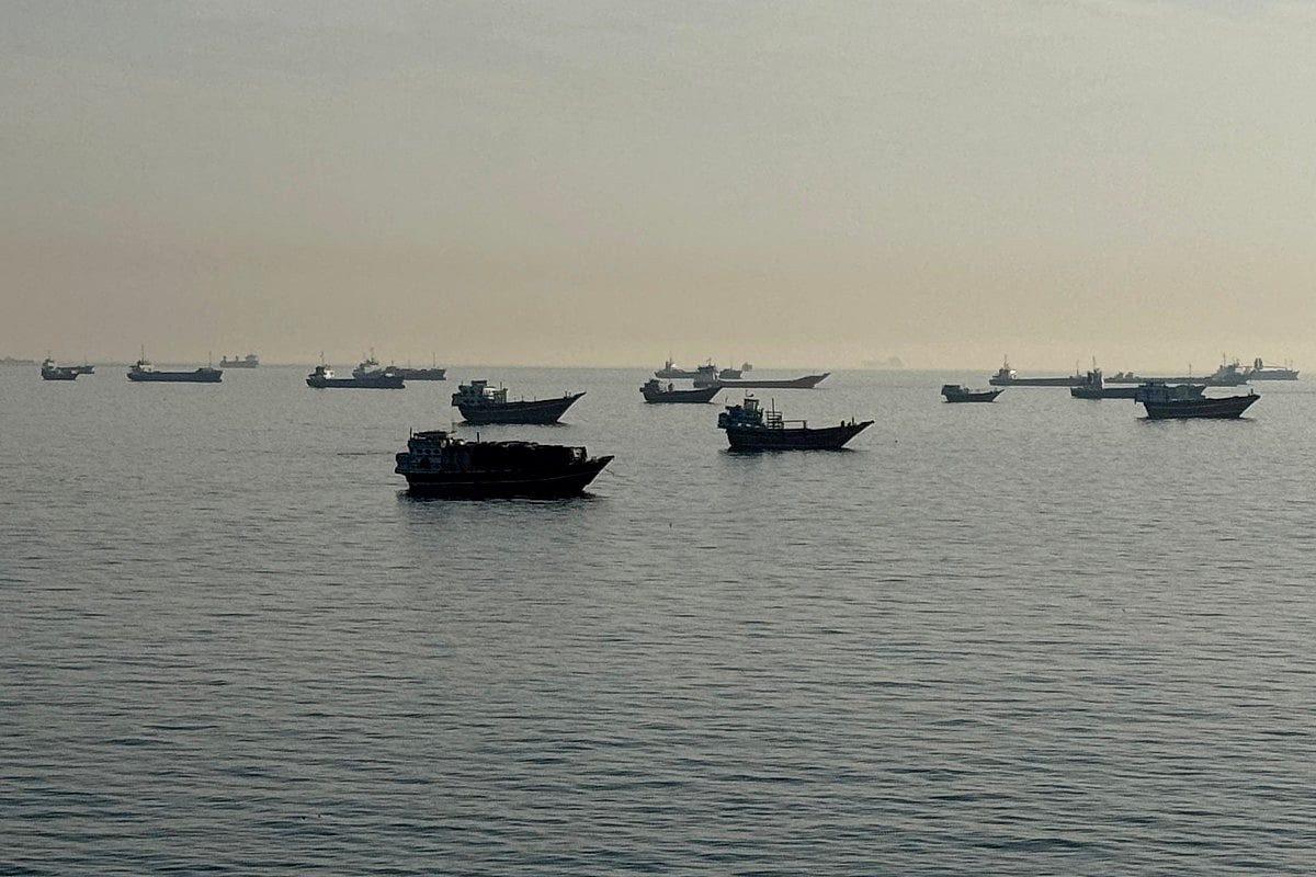 Vessels are seen anchored in the Strait of Hormuz, off the port city of Khasab on Oman’s northern Musandam Peninsula on May 17, 2026.