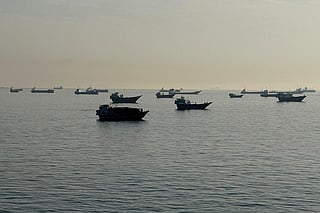 Vessels are seen anchored in the Strait of Hormuz, off the port city of Khasab on Oman’s northern Musandam Peninsula on May 17, 2026.