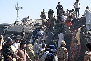 Security personnel and residents rescue injured blast victims from derailed carriages after an explosion targeted a train in Quetta on May 24, 2026.