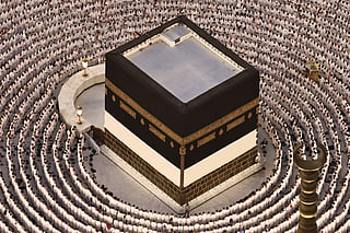 Muslims perform the evening prayer around the Kaaba, Islam's holiest shrine, at Grand Mosque complex on May 24, 2026, ahead of the annual Hajj pilgrimage.