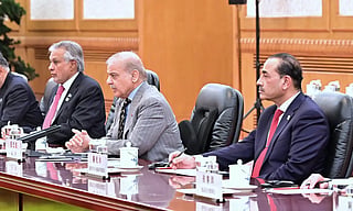 Field Marshal Asim Munir, Shehbaz Sharif and Ishaq Dar during a meeting during their trip to China