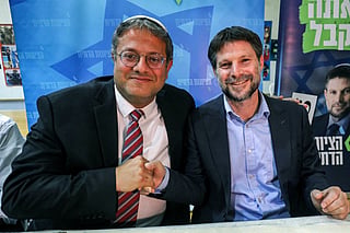 Itamar Ben-Gvir (L), Israeli far-right lawmaker and leader of the Otzma Yehudit (Jewish power) party, and Bezalel Smotrich, Israeli far-right lawmaker and leader of the Religious Zionist Party, attend a rally with supporters in the southern Israeli city of Sderot on October 26, 2022.