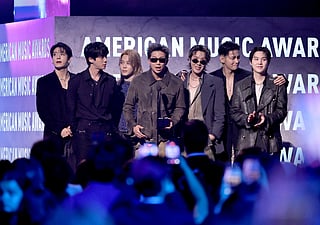 Jungkook, Jin, Jimin, RM, J-Hope, V and Suga of BTS accept the Artist of the Year award onstage during the 52nd American Music Awards at MGM Grand Garden Arena on May 25, 2026 in Las Vegas, Nevada.