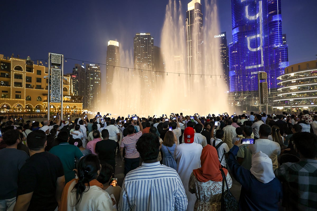 Huge crowd during Eid Al Adha celebrations at Dubai mall fountain area.